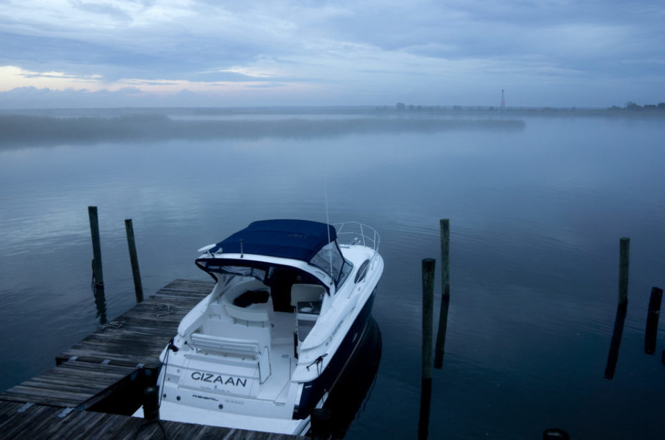 A boat at a waterfront dock in Apalachicola